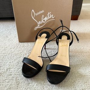 Christian Louboutin Loubi Queen 100 ankle strap heel in black Nappa.